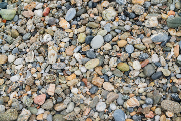 background surface of sea pebbles, stones and sand