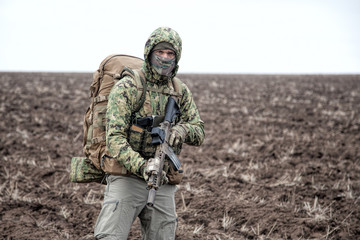 Portrait of modern army infantryman on march