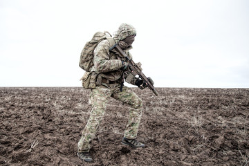 Portrait of modern army infantryman on march