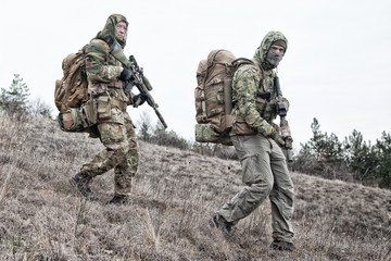 Military army soldiers team members patrolling area