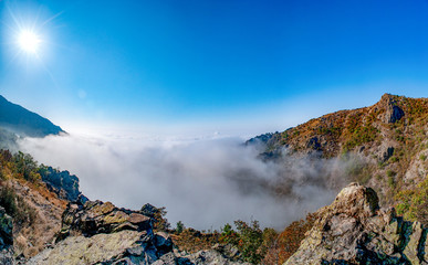 Blanket of fog on a sunny day in a rocky mountain range in Sliven, Bulgaria. 