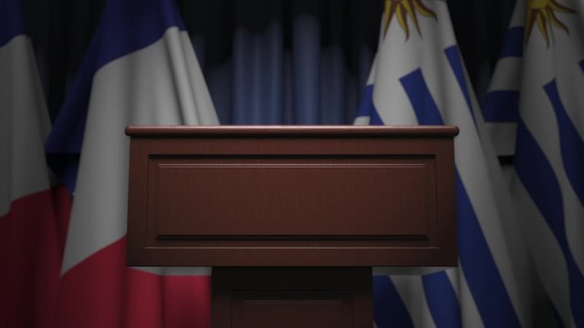 Flags of Uruguay and France and tribune, 3D animation