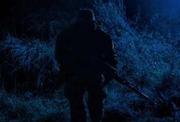 Infantry shooting with sniper rifle in darkness