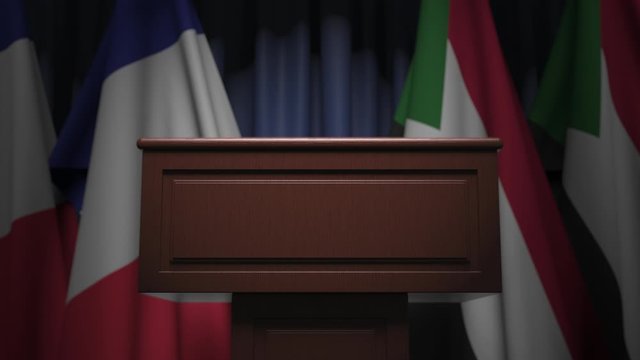 Many flags of Sudan and France behind speaker tribune, 3D animation