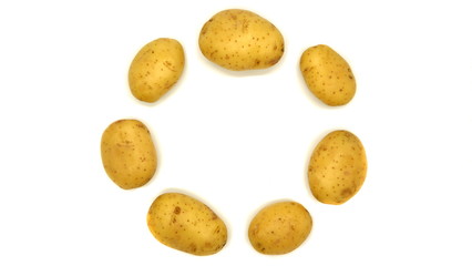 Fototapeta na wymiar Young white potato, top view. Isolated potatoes on a white background. Fresh food for vegetarians. Raw vegetable, root vegetable. Photo harvesting potatoes for a designer.