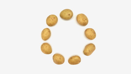Young white potato, top view. Isolated potatoes on a white background.  Fresh food for vegetarians. Raw vegetable, root vegetable. Photo harvesting potatoes for a designer.