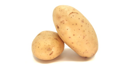 Young white potato, top view. Isolated potatoes on a white background.  Fresh food for vegetarians. Raw vegetable, root vegetable. Photo harvesting potatoes for a designer.