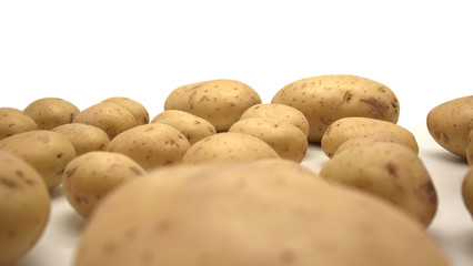 Young white potato, top view. Isolated potatoes on a white background.  Fresh food for vegetarians. Raw vegetable, root vegetable. Photo harvesting potatoes for a designer.