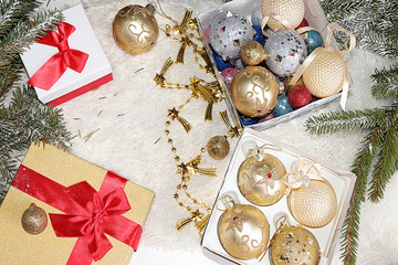 Christmas and New Year background with gift boxes, Christmas trees and Christmas decorations, top view, flet lay. New Year card for congratulations, selective focus, festive atmosphere © Светлана Балынь