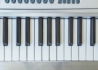 Fototapeta premium top view black and white part of electronic keyboard synthesizer