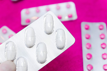 multicolored pills and antibiotics, the concept of drug treatment and pharmaceuticals. Treatment at...