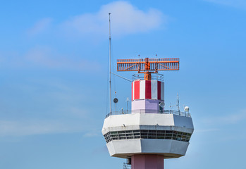 Radar  air traffic control tower in international airpor under blue sky.        