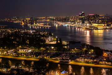 Fototapeta na wymiar Nightly view from the A'dam Lookout across the IJ river and the city of Amsterdam