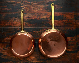 french Vintage Copper saute pans, kitchen utensil on wooden background