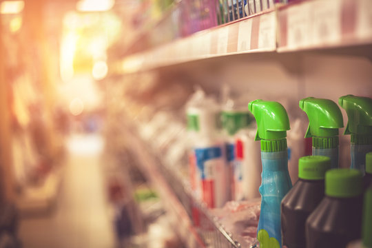Cleaning products, sprays and cans on supermarket shelf