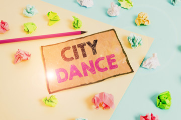 Handwriting text writing City Dance. Conceptual photo activity of dancing for pleasure or in order to entertain others Colored crumpled papers empty reminder blue yellow background clothespin