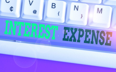 Word writing text Interest Expense. Business photo showcasing cost of debt that has occurred during...