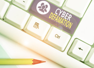 Word writing text Cyber Defamation. Business photo showcasing slander conducted via digital media...