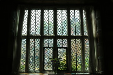 Window shot from inside a Medieval stone house. Stone window from a house in England.