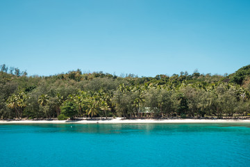 Small inhabited island in group of Yasawa, Fiji with crystal clear water, holiday destination