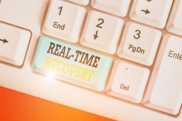 Writing note showing Real Time Recovery. Business concept for maximum time period in which recent...