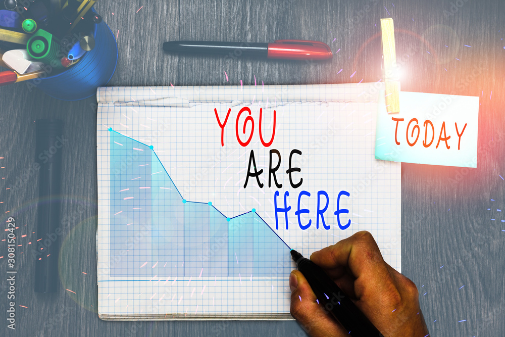 Poster writing note showing you are here. business concept for this is your location reference point global