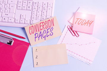 Text sign showing Conversion Pages. Business photo showcasing appears in response to clicking on a search engine Paper blue desk computer keyboard office study notebook chart numbers memo