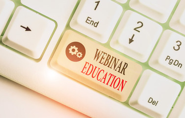 Handwriting text Webinar Education. Conceptual photo online meeting or presentation held via the...
