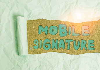 Word writing text Mobile Signature. Business photo showcasing digital signature generated either on a mobile phone Cardboard which is torn in the middle placed above a wooden classic table