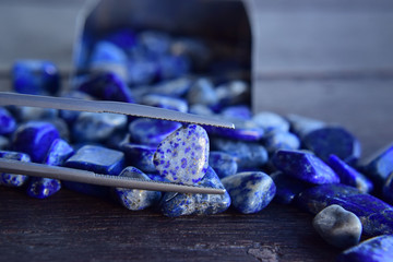  Lapis Is a beautiful natural gemstone on a wooden floor