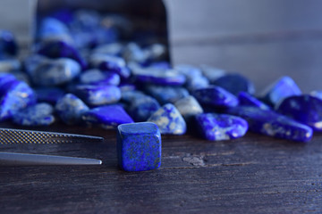  Lapis Is a beautiful natural gemstone on a wooden floor