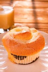 side view bread and cup of soy  milk in a sunny morning