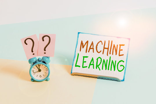 Conceptual hand writing showing Machine Learning. Concept meaning scientific study of algorithms and statistical models Alarm clock beside a Paper sheet placed on pastel backdrop