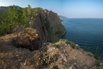 Fototapeta na wymiar A Seagull cliff in the Devil's Bridge tract on the shore of Lake Baikal