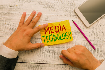 Handwriting text Media Technology. Conceptual photo process of huanalysis origin that used to convey media Hand hold note paper near writing equipment and modern smartphone device