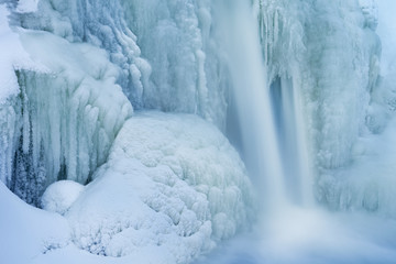 Fototapeta na wymiar Winter, Comstock Creek Waterfall Framed by Ice