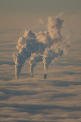 smokestacks in sea of fog over Rhine Valley, Mannheim, Baden-Wurttemberg, Germany