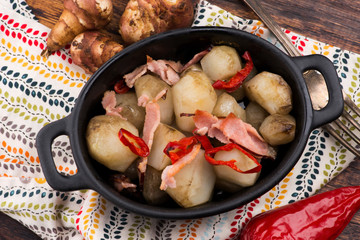 Jerusalem artichoke au gratin with ham and chili. Fricassee, fruits