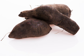 Fototapeta premium Fresh Yacon roots on white background