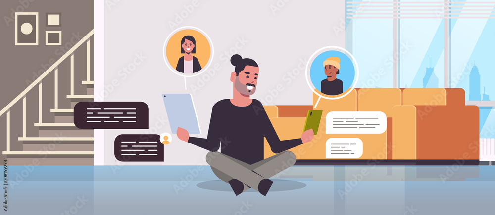 Poster man sitting on floor using chatting apps on digital devices social network chat bubble communication