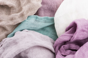 Multicolored textile with violet tones and colorful accents and rich, detailed texture, flax