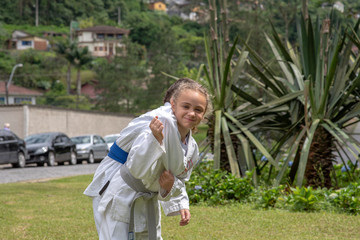 Athletes boy and girl train throws judo