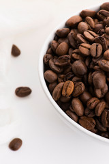 Fototapeta premium Bowl of caffee beans on a white background