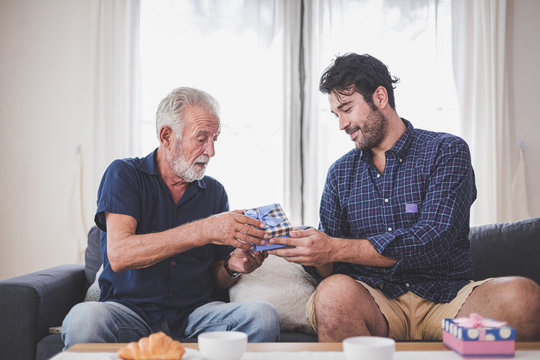 Father's Day Concept - Son Hold A Gift Box To Give To The Father On Important Occasions.