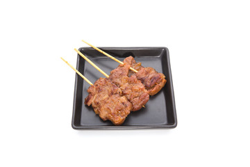 Pork stick grilled on white isolated background. Traditional Thai breakfast food.