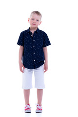 Handsome little boy in full growth on a white background. The co