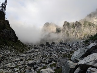 Rocky mountain at sunrise appears in the mist