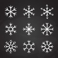 Frozen snowflake symbol collection vector illustration. Chalk style line white snowflakes isolated on blackboard for abstract christmas celebration design or winter season decoration ornament