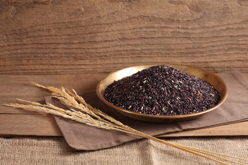 close up riceberry rice in golden tray on table, riceberry rice in chinese kitchen background