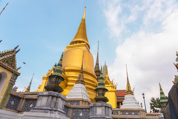 Fototapeta premium Tourists at the Grand Palace a famous tourist destination that includes the Temple of the Emerald Buddha (Wat Phra Kaew) the most sacred Buddhist temple in Thailand